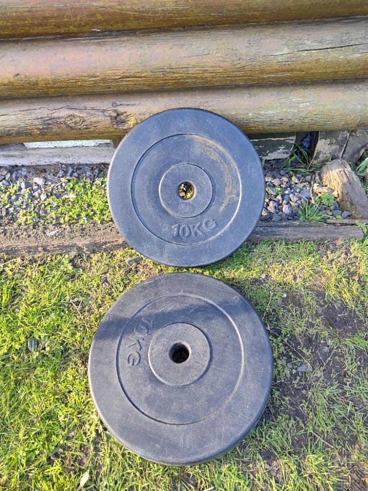 2 discos de pesas recubiertos de 10 kg cada uno